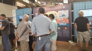 Cannabis entrepreneurs crowding around and learning about business management software